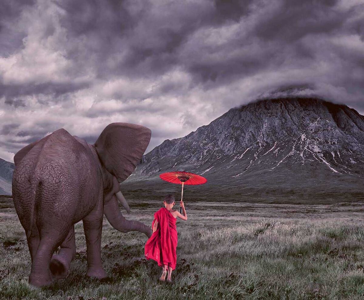 An elephant gently holding a girl’s hand as she walks with a red umbrella, with stormy skies and a misty mountain in the background