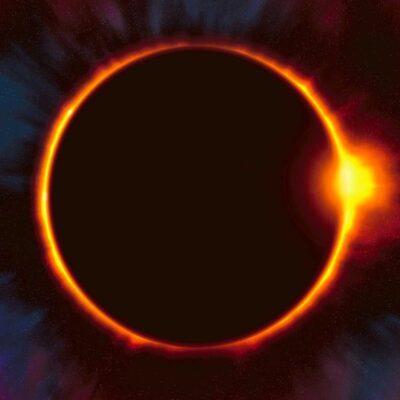 A dramatic solar eclipse with a fiery corona glowing around the moon casting a vibrant halo against a star speckled space background