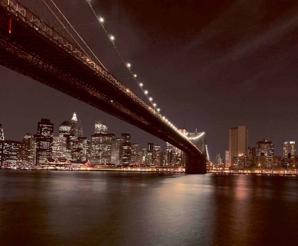 Night view of Brooklyn Bridge with New York City's skyline in the background, captured in an LED Box Frame to enhance your home or office decor.