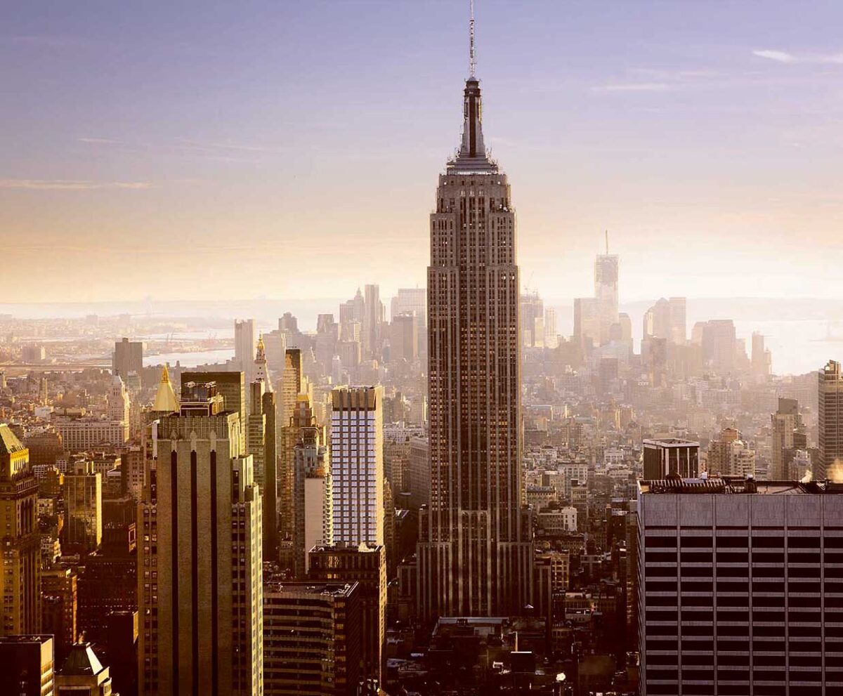 View of the Empire State Building towering over New York City at sunset, captured beautifully in an LED Box Frame for a timeless cityscape.