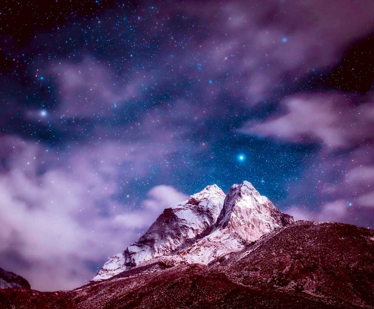 A stunning view of the Himalayas under a cosmic sky, illuminated by the twinkling stars, perfect for displaying in an LED Box Frame.