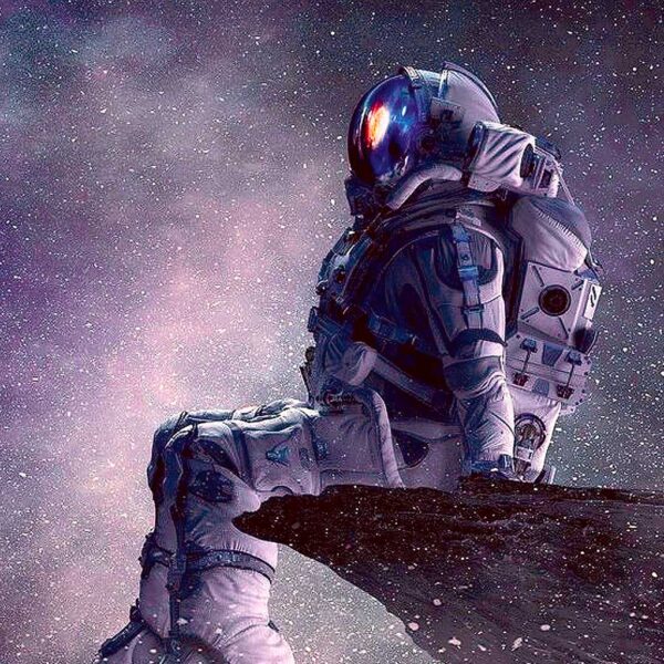 Astronaut sitting in space with a stunning cosmic background, featured in LED Box Frame designs.