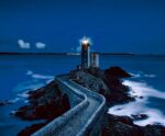 Coastal lighthouse with light beam, illuminated in an energy-efficient LED Box Frame, perfect for home and office decor.