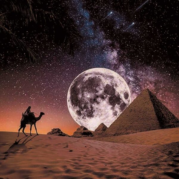 A lone camel and rider crossing the desert near the Egyptian pyramids under a massive full moon and starry sky